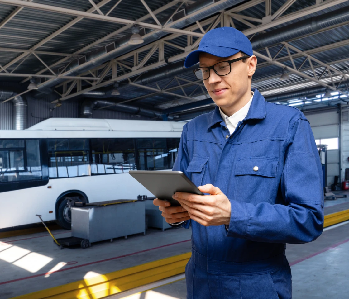 Technician in blue uniform with tablet