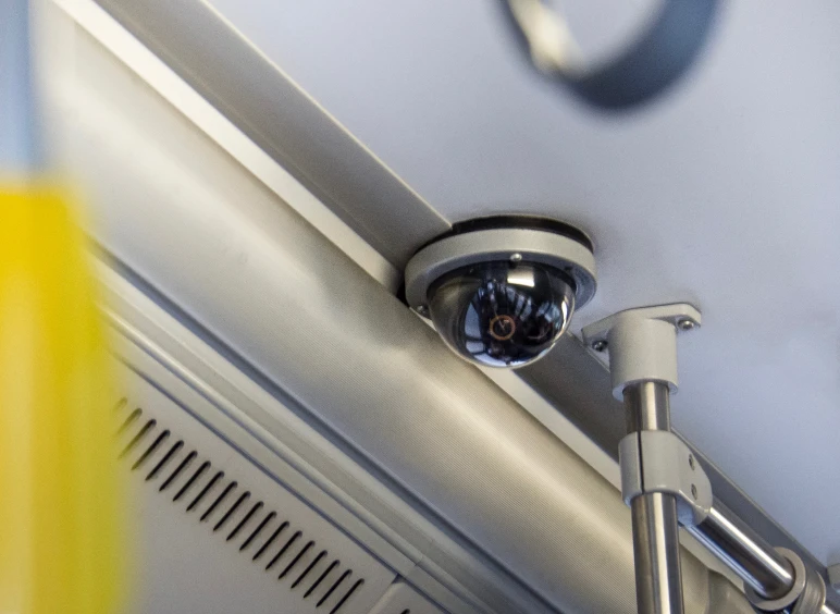 Dome security camera on transit ceiling